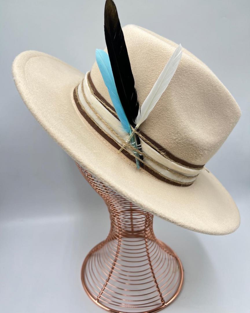 Beige hat with turquoise  feather