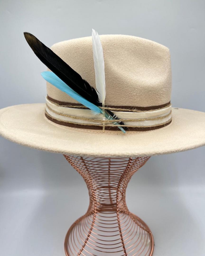 Beige hat with turquoise  feather