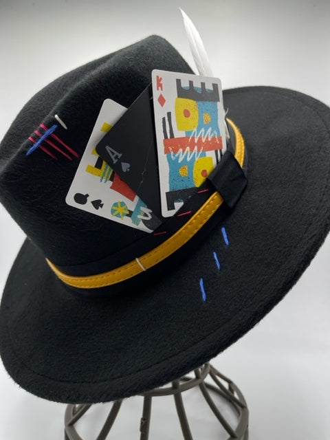 Black fedora with colorful cards