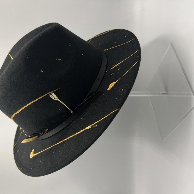 Black fedora with gold details