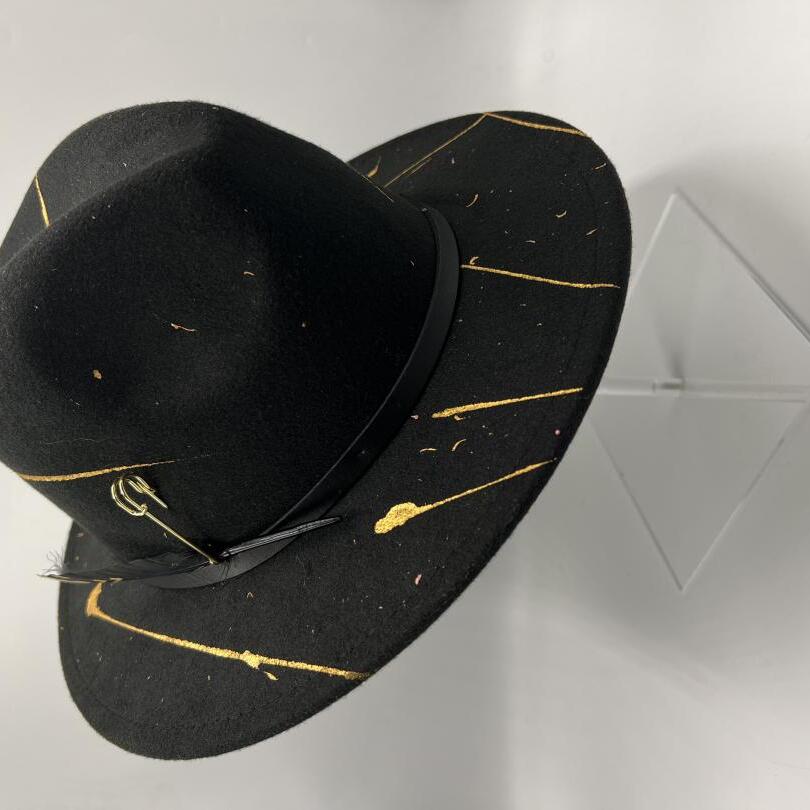 Black fedora with gold details