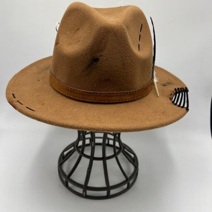 Brown fedora with burns and cut