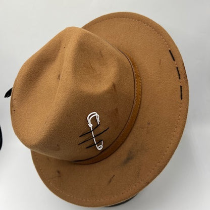 Brown fedora with burns and cut