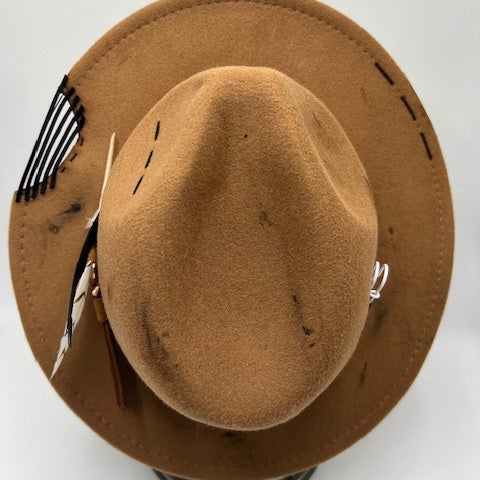 Brown fedora with burns and cut