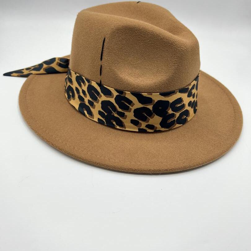 Brown fedora with tiger print scarf