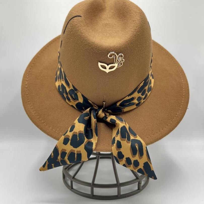 Brown fedora with tiger print scarf