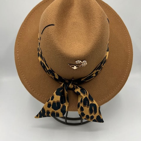 Brown fedora with tiger print scarf