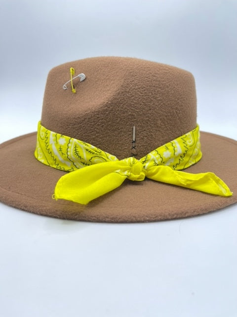 Brown fedora with yellow scarf