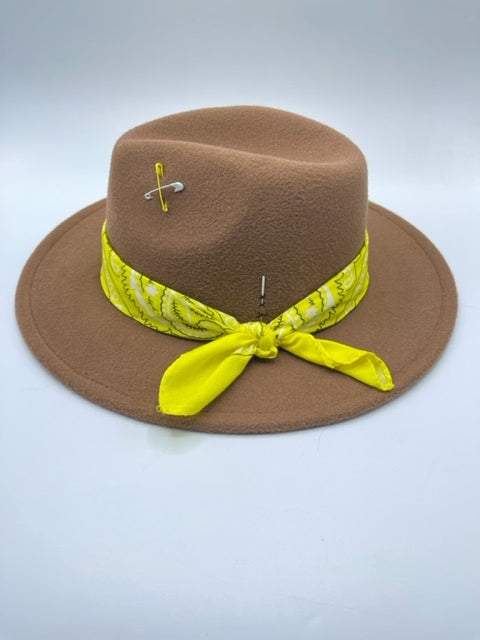 Brown fedora with yellow scarf