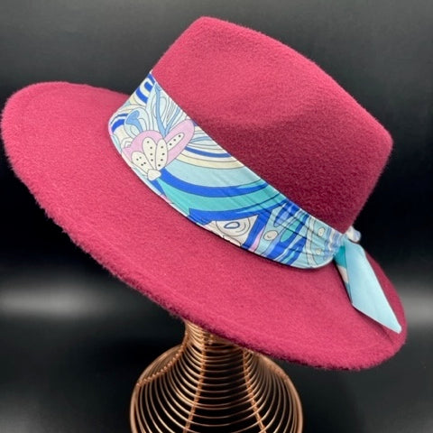 Burgundy fedora with flower accessory