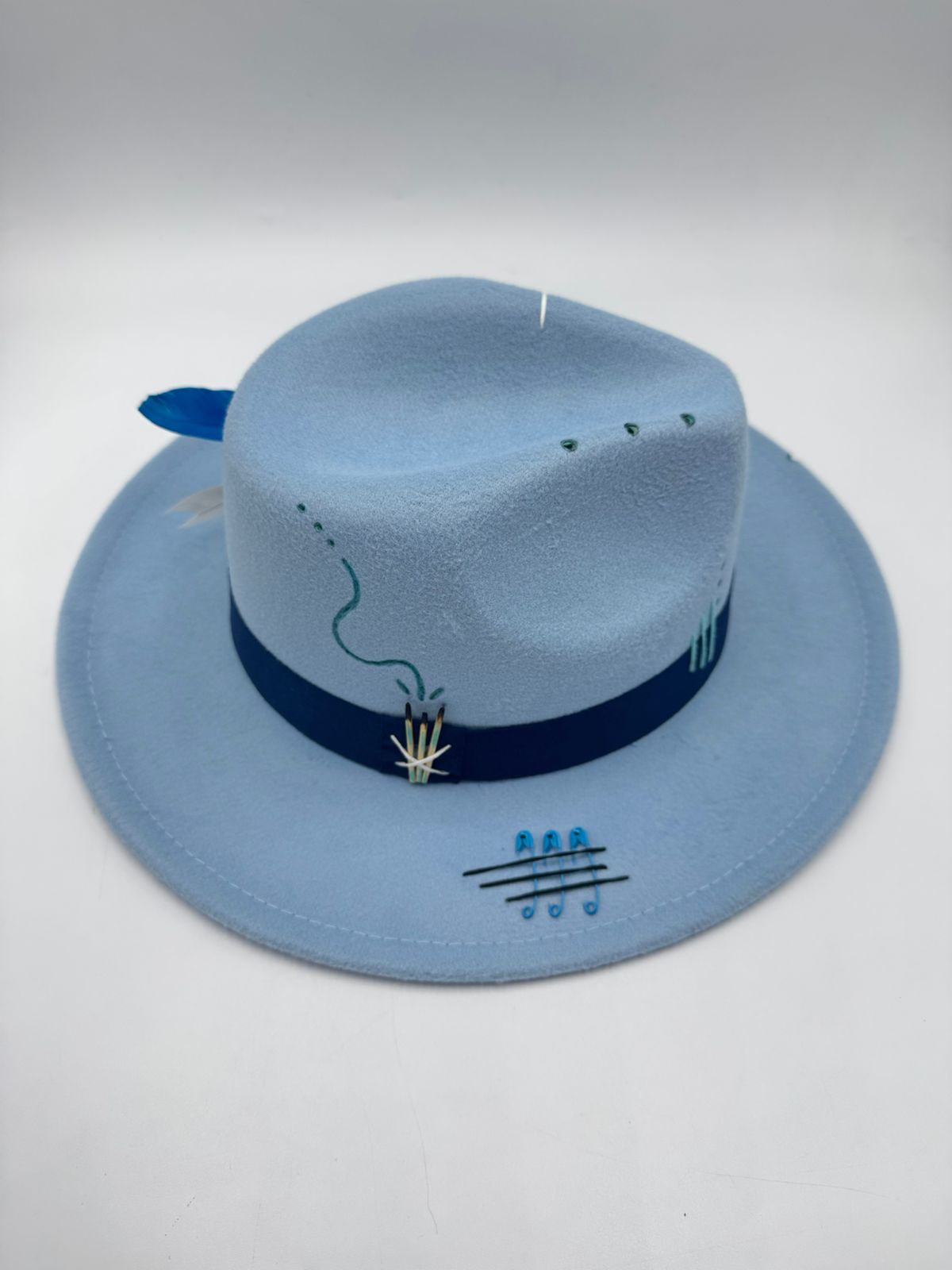 Baby blue fedora with cards and feathers