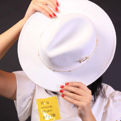 Fedora accessorized with airplane and pearls