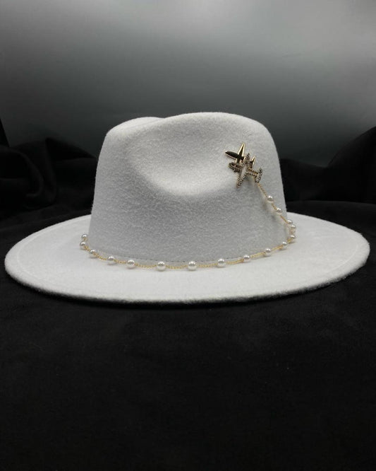 Fedora accessorized with airplane and pearls