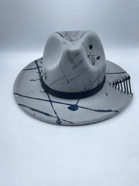 Grey fedora with safety pins