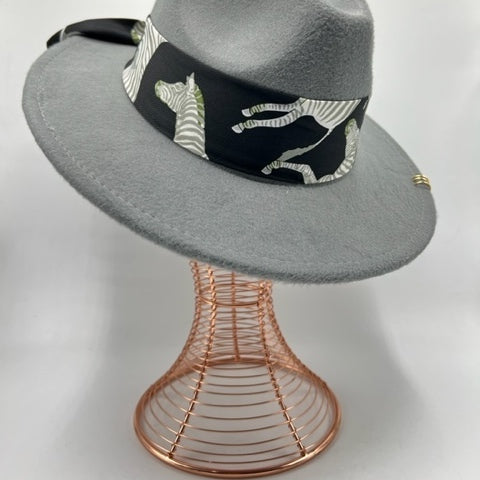 Grey fedora with yellow accessories