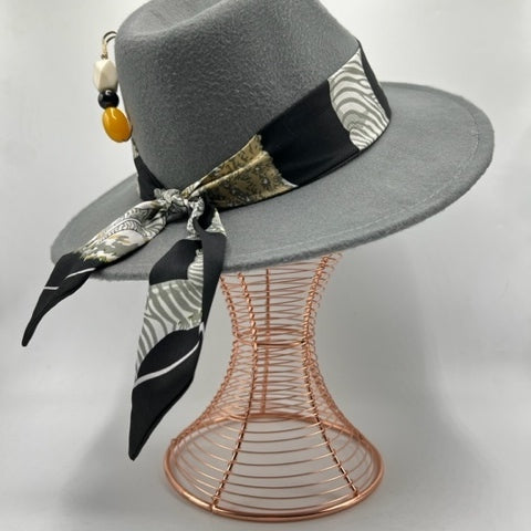 Grey fedora with yellow accessories