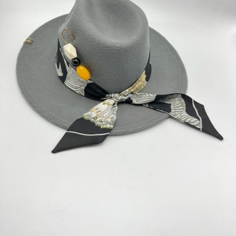 Grey fedora with yellow accessories