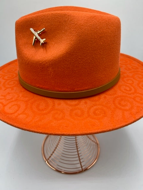 Hand drawn orange fedora with airplane