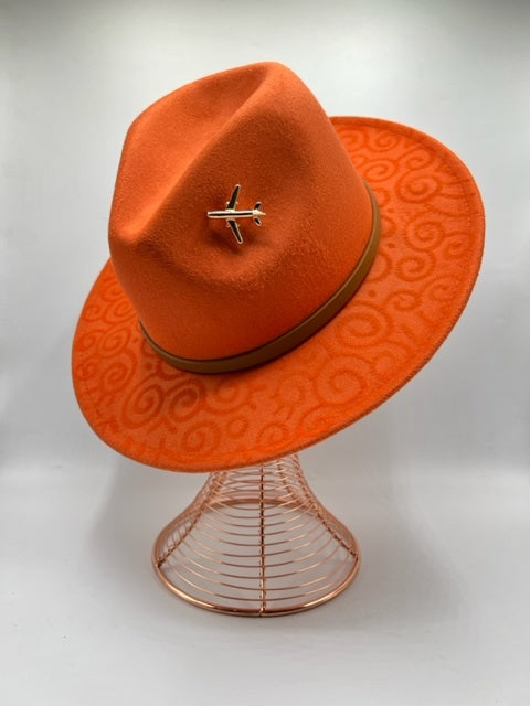 Hand drawn orange fedora with airplane