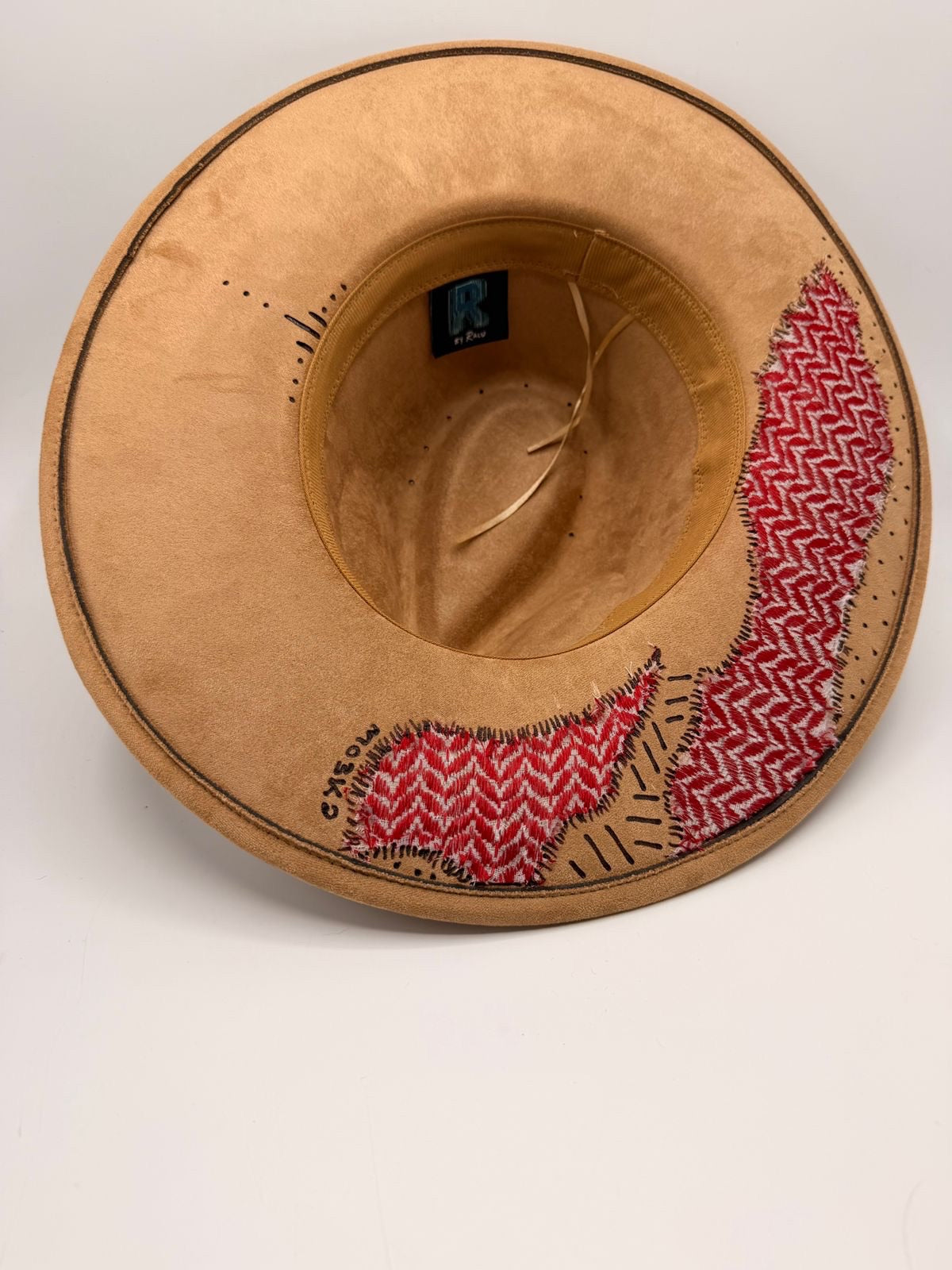 Wide brim light brown fedora with red shemagh fabric