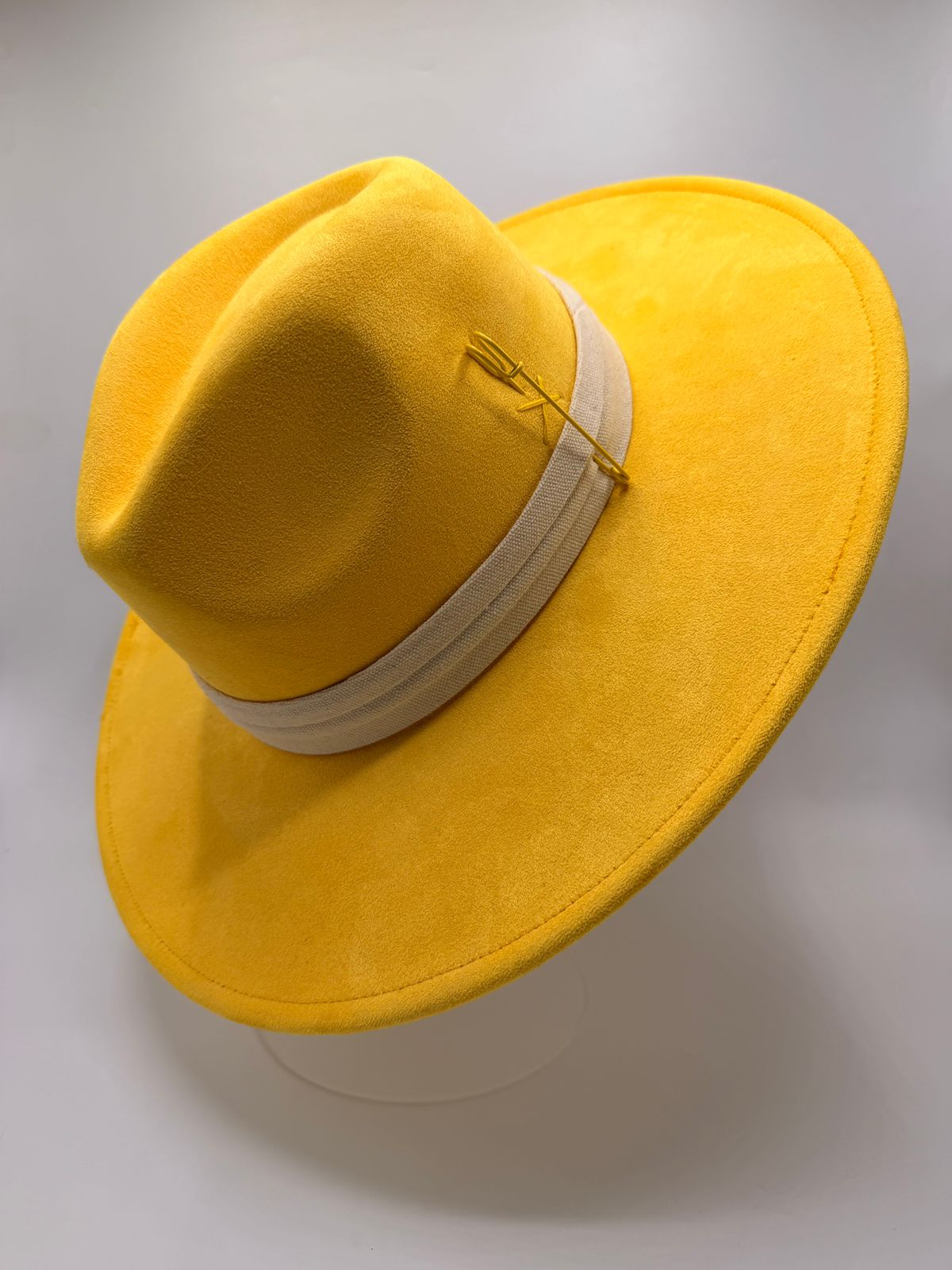 Yellow wide brim fedora with feathers