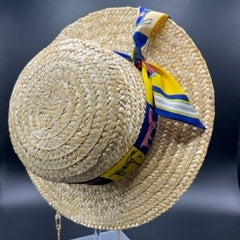 Natural straw boater with blue scarf and gold chain