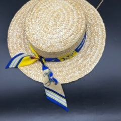 Natural straw boater with blue scarf and gold chain