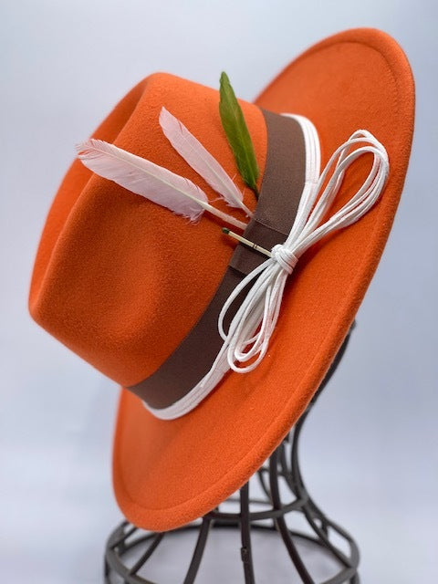 Orange fedora with feathers