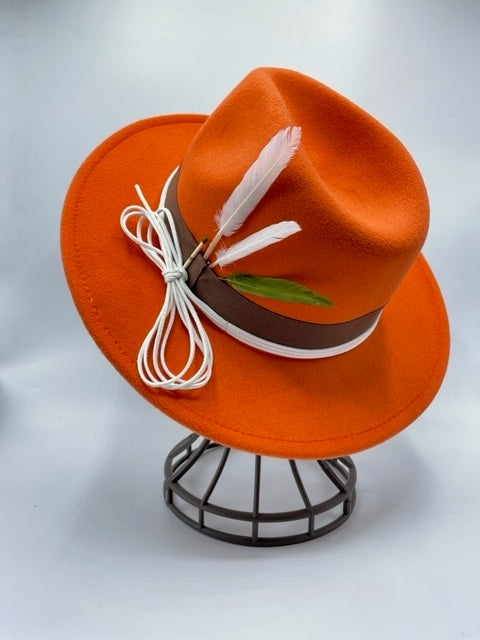 Orange fedora with feathers