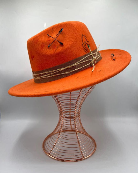 Orange fedora with playing card and flame