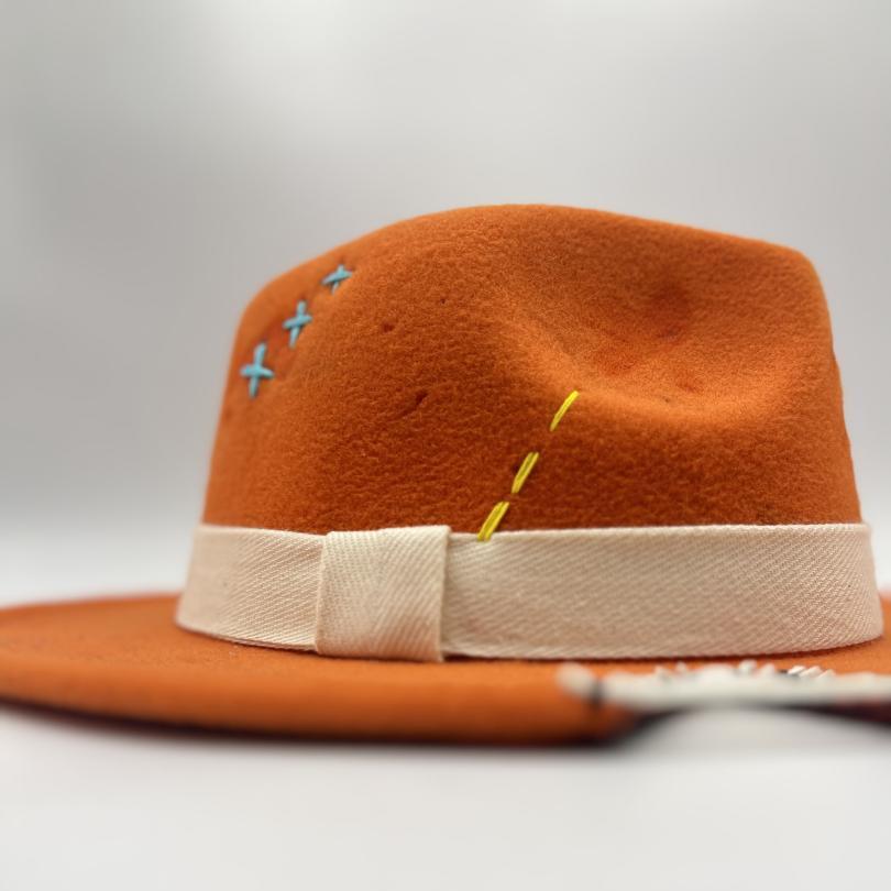 Orange fedora with white and blue details