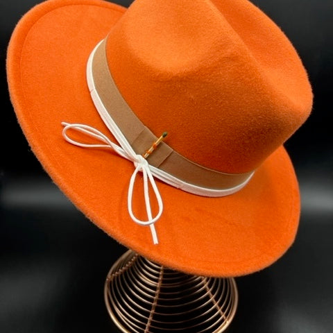 Orange fedora with white leather straps