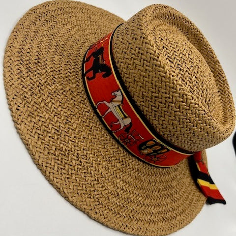 Paper straw beach hat with black and red scarf