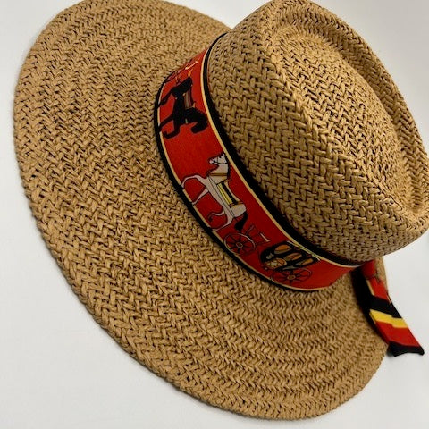 Paper straw beach hat with black and red scarf