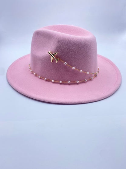 Pink wool fedora hat with airplane accessory