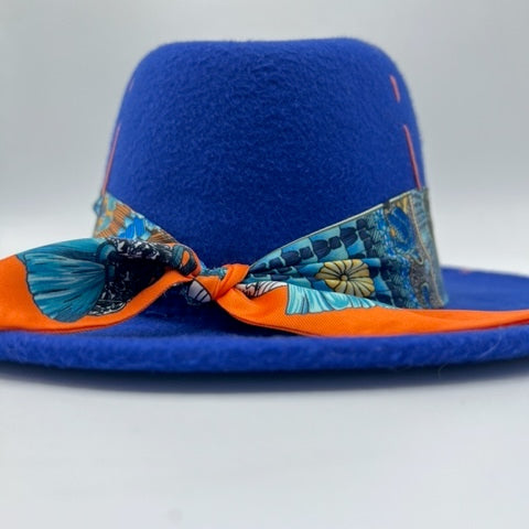 Royal blue fedora with orange details