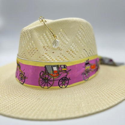 Straw hat with golden pin