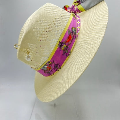 Straw hat with golden pin