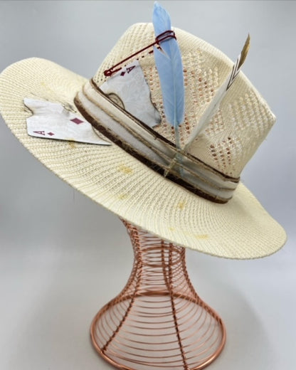 Straw summer hat with feathers