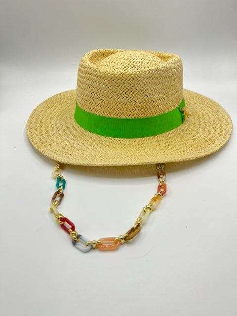 Straw summer hat with green band and airplane accessory