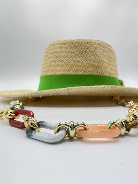 Straw summer hat with green band and airplane accessory