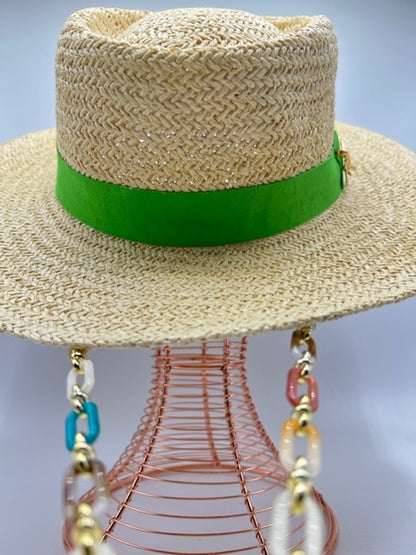 Straw summer hat with green band and airplane accessory