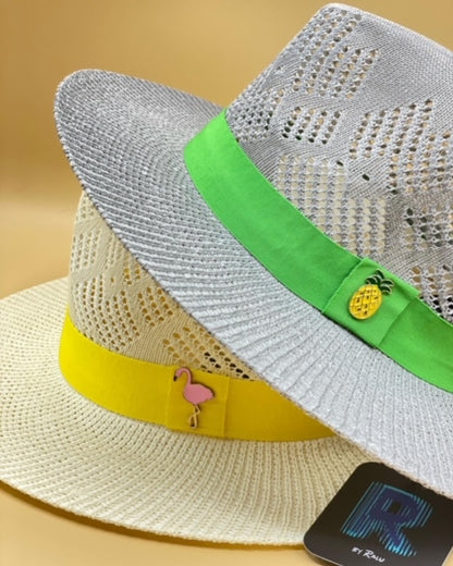 Straw summer hat with green band and pineapple accessory