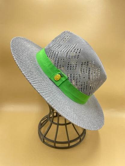 Straw summer hat with green band and pineapple accessory