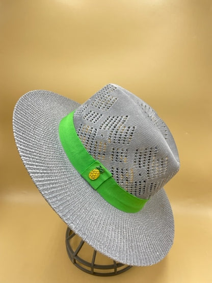 Straw summer hat with green band and pineapple accessory