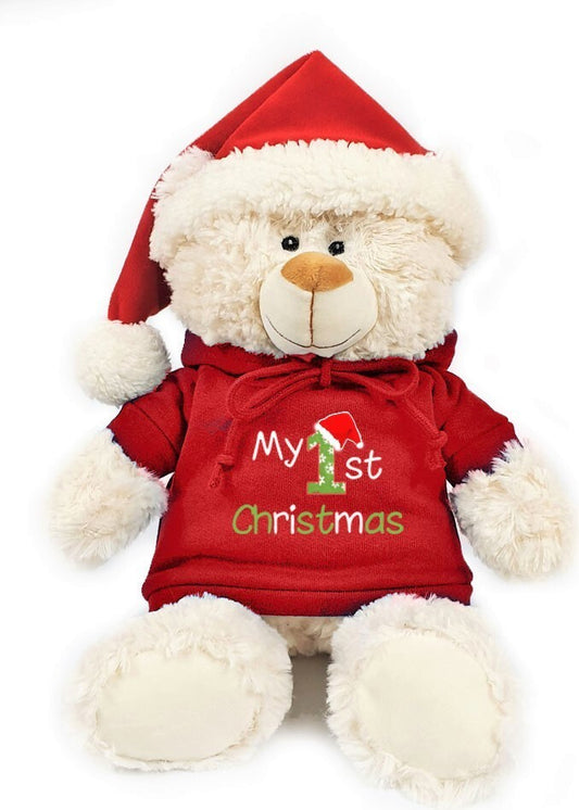 Super soft fluffy Christmas teddy bear with My 1st Christmas print on trendy red hoodie and cute Santa hat. Size 38cm.