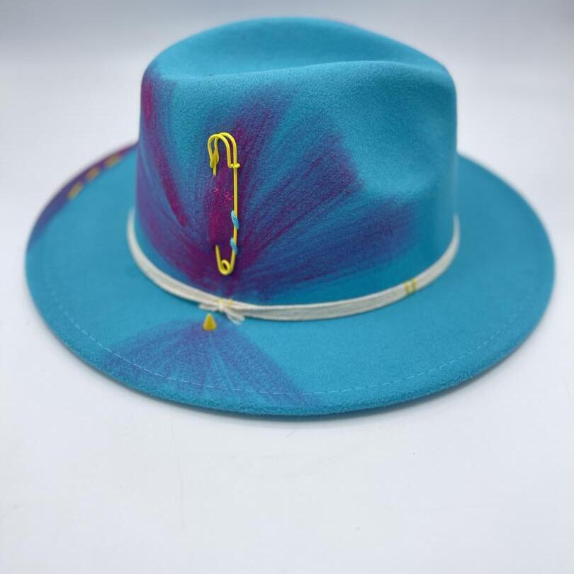 Turquoise fedora with fuchsia drawing