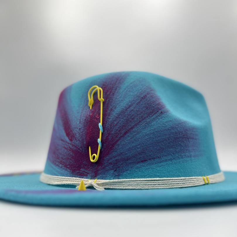 Turquoise fedora with fuchsia drawing