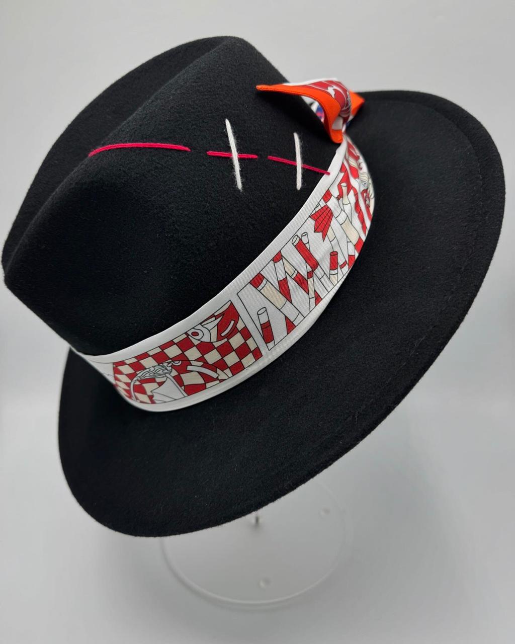 Black fedora with white and red details