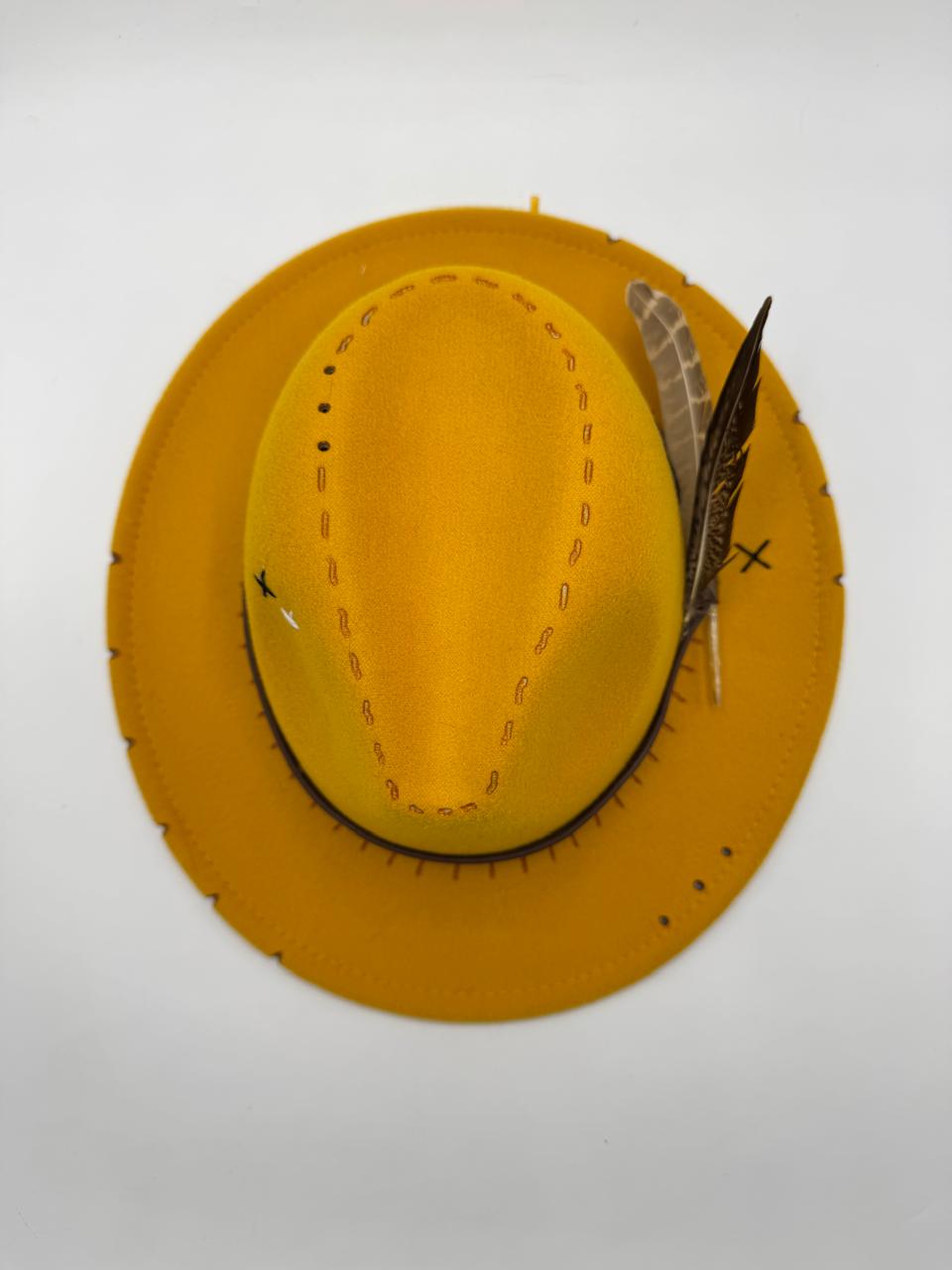 Yellow mustard fedora with feathers and carving